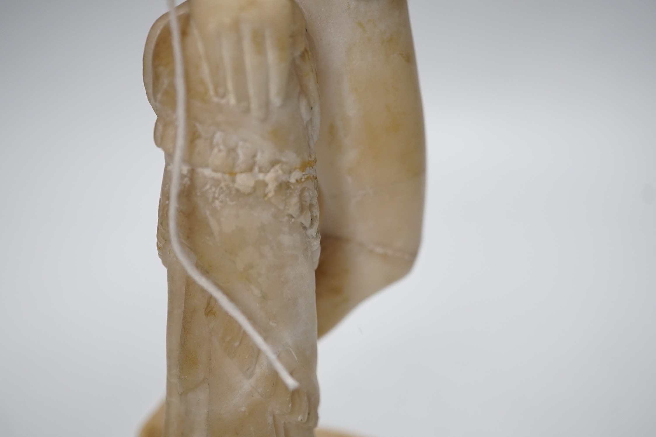 A carved alabaster female classical figure, the Greek slave Hiram Powers, 36cms high